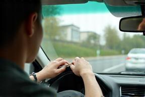 International driver checking compliance stickers before entering German city